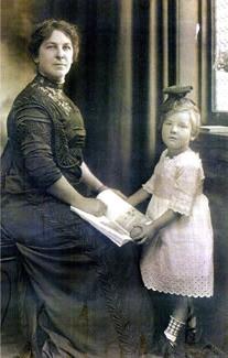 Cook's wife, Arrietta Morrill Cook, and daughter, Catherine, pose for a picture inside the Gaunt House.